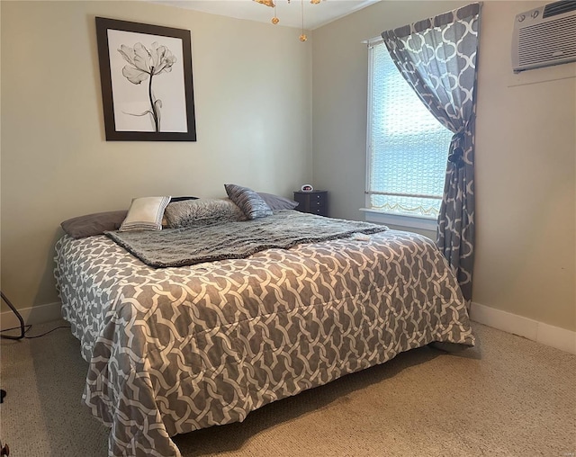 bedroom with a wall mounted AC and carpet