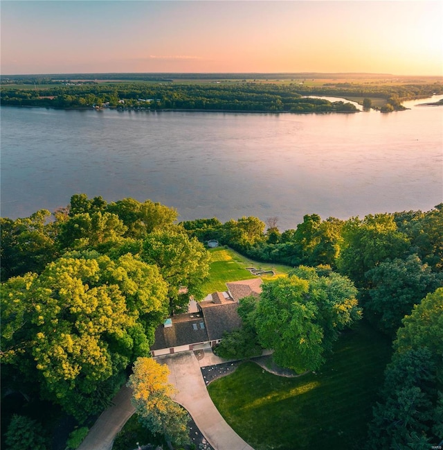 aerial view at dusk with a water view