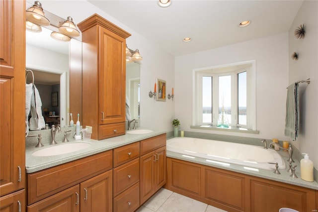 bathroom with tile patterned floors, vanity, and a bathtub