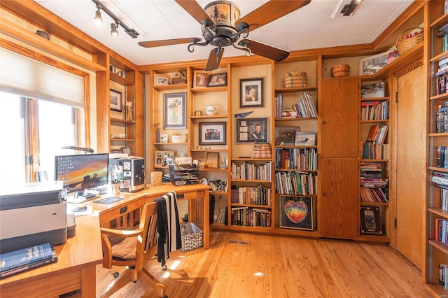 office area featuring ceiling fan, light hardwood / wood-style floors, track lighting, and ornamental molding