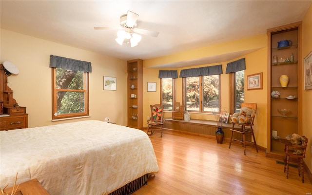 bedroom featuring ceiling fan and light hardwood / wood-style flooring