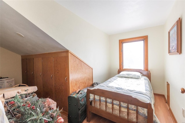 bedroom with hardwood / wood-style flooring