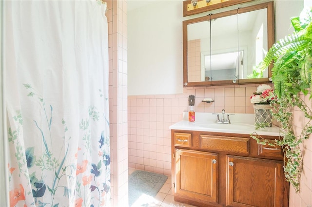 bathroom with vanity, tile walls, tile patterned floors, and a shower with shower curtain