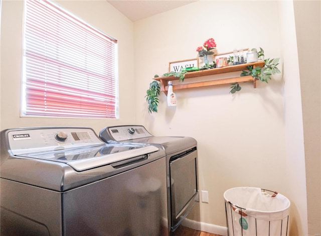 clothes washing area featuring washing machine and dryer