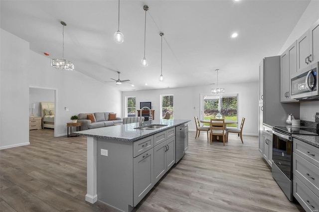 kitchen with decorative light fixtures, gray cabinets, and appliances with stainless steel finishes