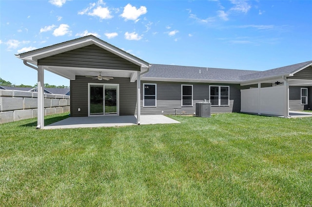 back of house with ceiling fan, central AC unit, a patio area, and a lawn