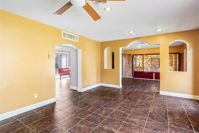 spare room with ceiling fan