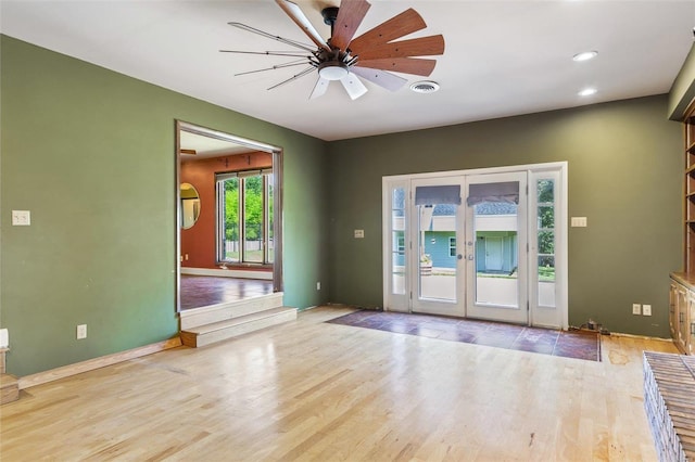 interior space featuring french doors, ceiling fan, and light wood-type flooring