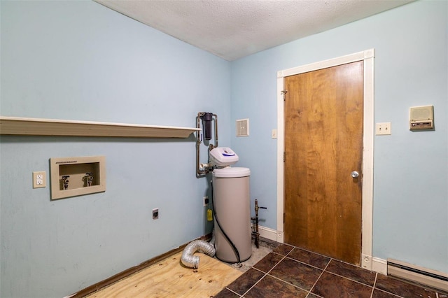 laundry room featuring hookup for a washing machine, a textured ceiling, dark tile patterned flooring, a baseboard radiator, and hookup for an electric dryer