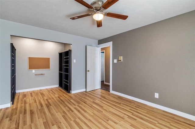 unfurnished bedroom with ceiling fan and light wood-type flooring