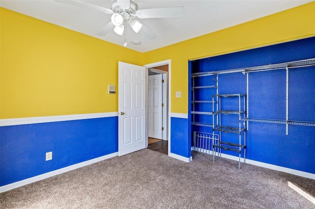 unfurnished bedroom with carpet floors, ceiling fan, and a closet