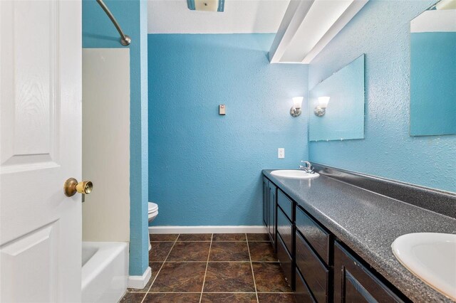 full bathroom with dual vanity, toilet, shower / tub combination, and tile patterned flooring