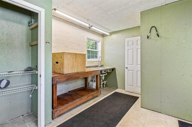 interior space featuring sink and tile patterned floors