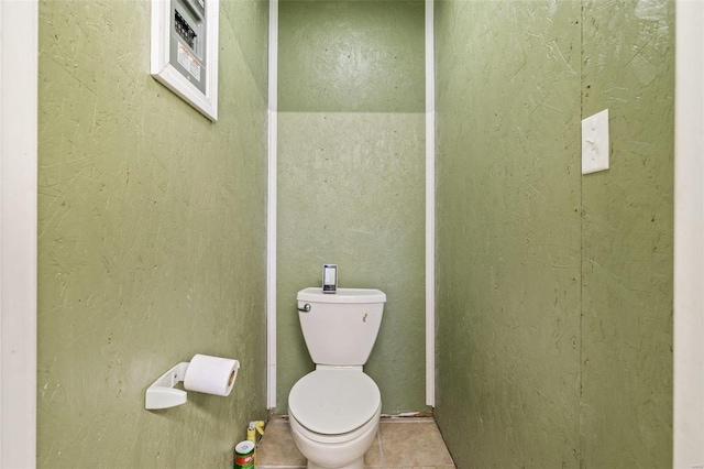 bathroom featuring tile patterned flooring and toilet