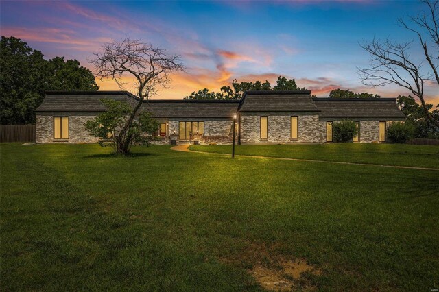 view of front of home with a lawn