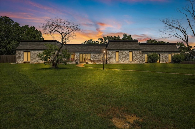 view of front of house with a yard