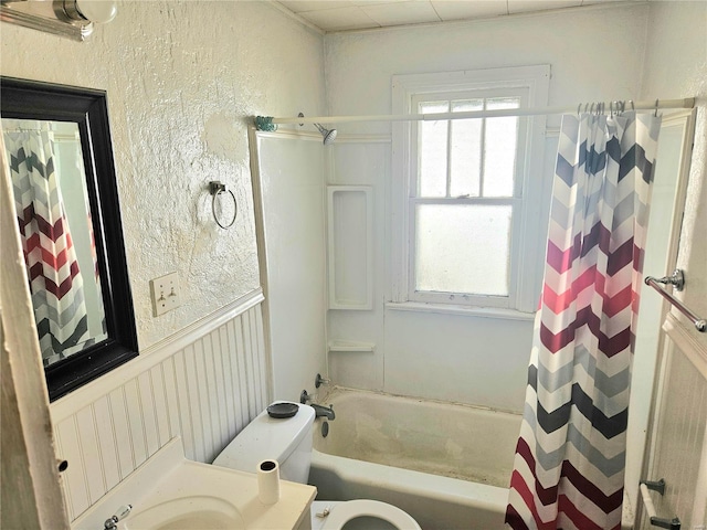 full bathroom featuring vanity, toilet, and shower / bath combination with curtain