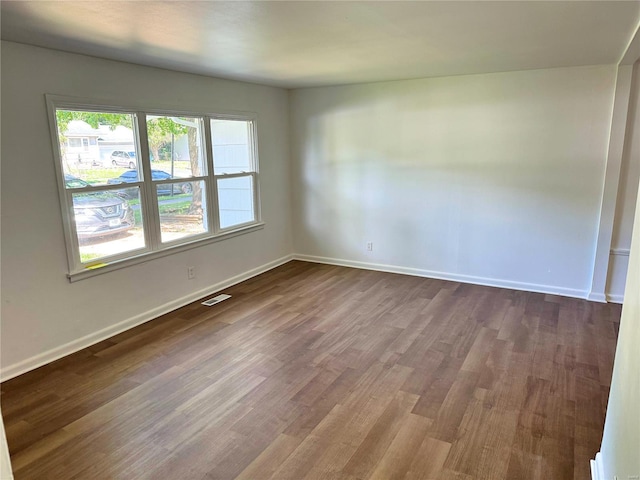 spare room featuring hardwood / wood-style floors