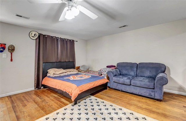 bedroom with light wood-type flooring and ceiling fan