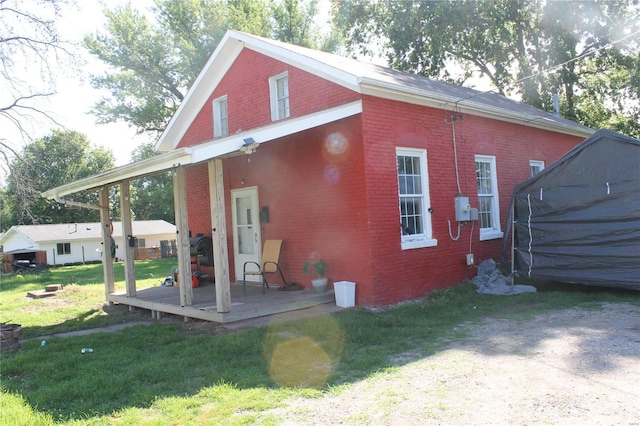 rear view of house with a lawn