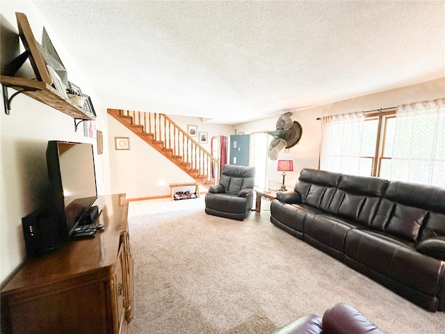 living room with carpet floors and a textured ceiling