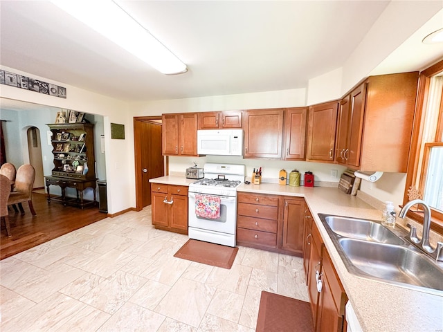 kitchen with white appliances and sink