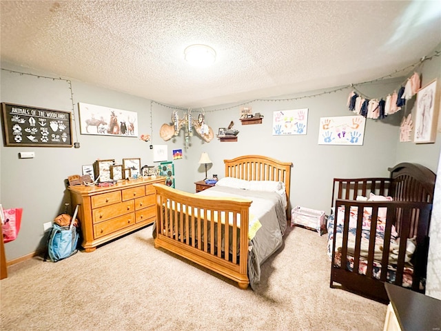 carpeted bedroom featuring a textured ceiling