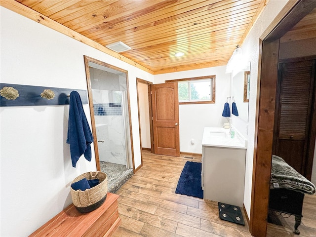 bathroom featuring vanity, an enclosed shower, and wood ceiling