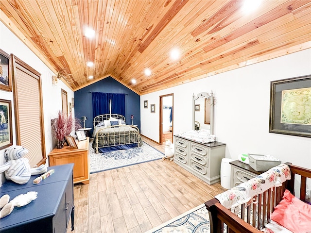 bedroom with light wood-type flooring, vaulted ceiling, and wooden ceiling