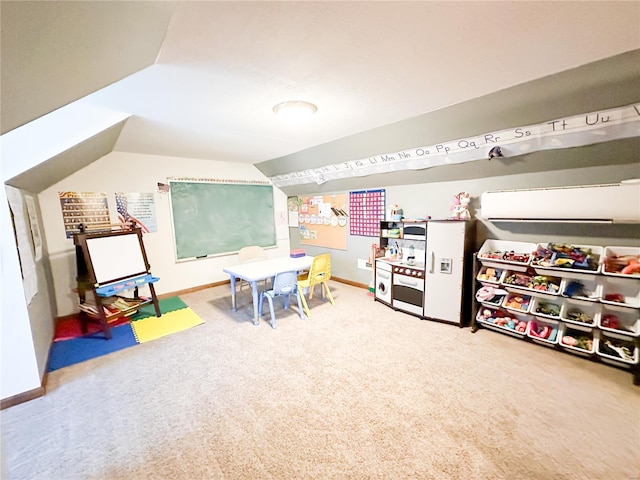 rec room with carpet flooring and vaulted ceiling