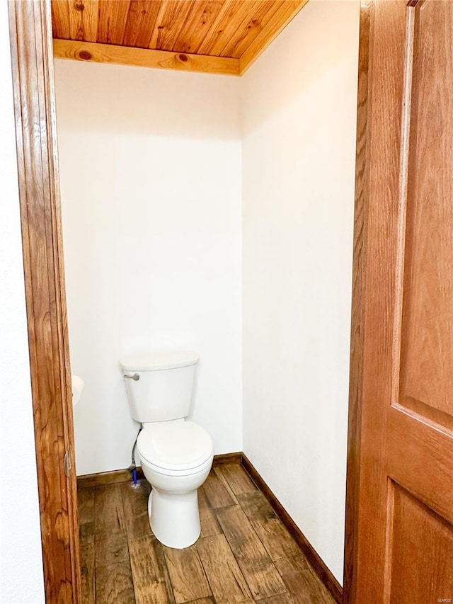 bathroom with toilet and wood ceiling