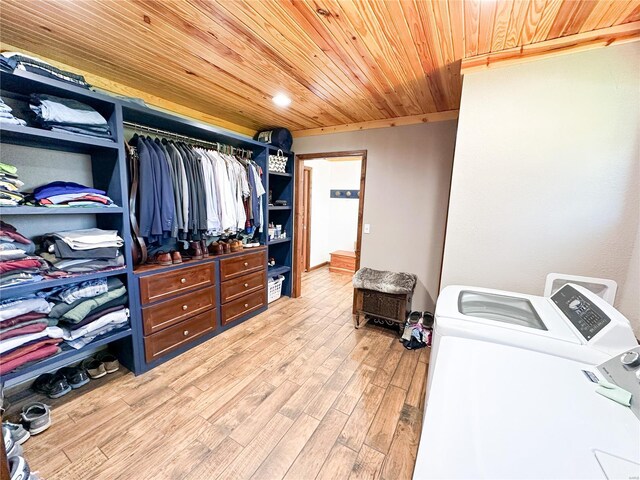 spacious closet with light wood-type flooring and washer and clothes dryer