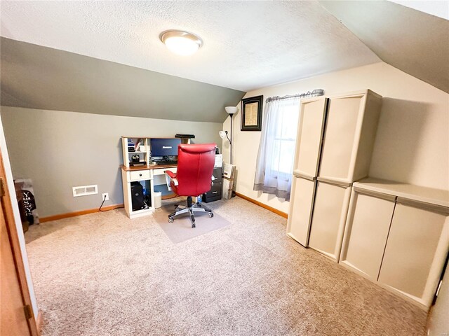 office with light carpet, a textured ceiling, and vaulted ceiling