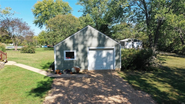 garage with a yard