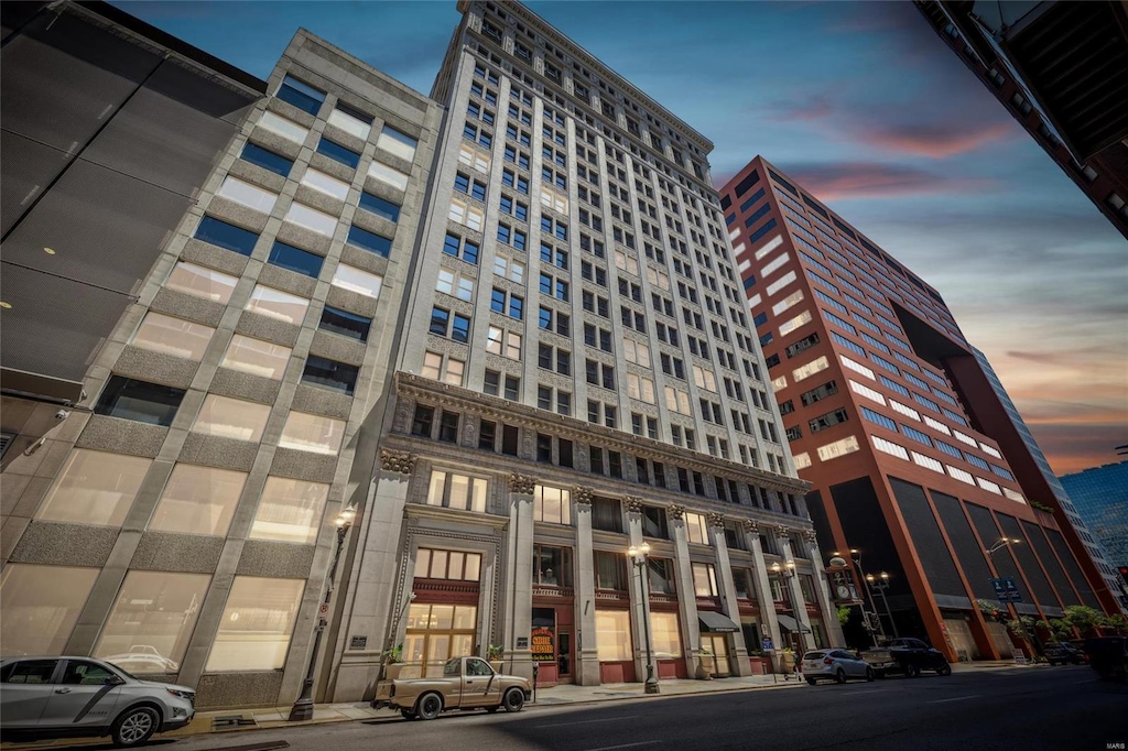 view of outdoor building at dusk