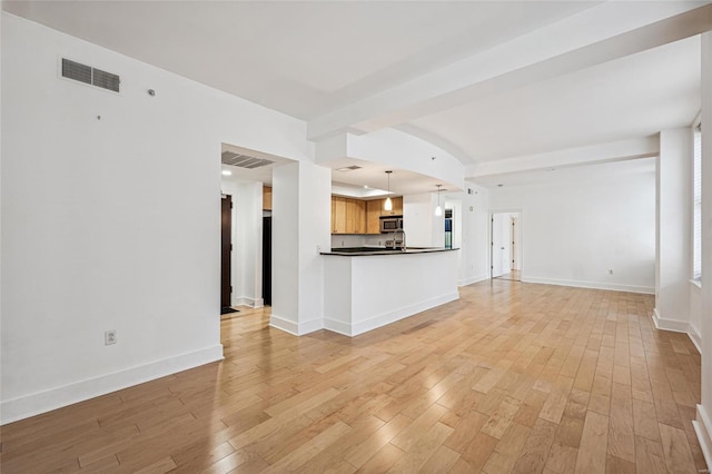 unfurnished living room featuring light hardwood / wood-style floors