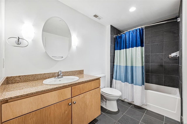 full bathroom featuring toilet, shower / bath combo with shower curtain, vanity, and tile patterned flooring