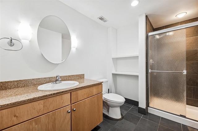 bathroom with tile patterned flooring, vanity, toilet, and an enclosed shower