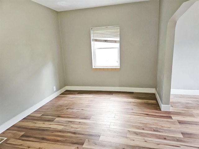 spare room featuring light wood-type flooring