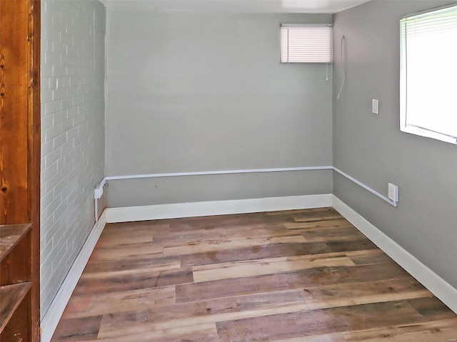 unfurnished room featuring hardwood / wood-style floors