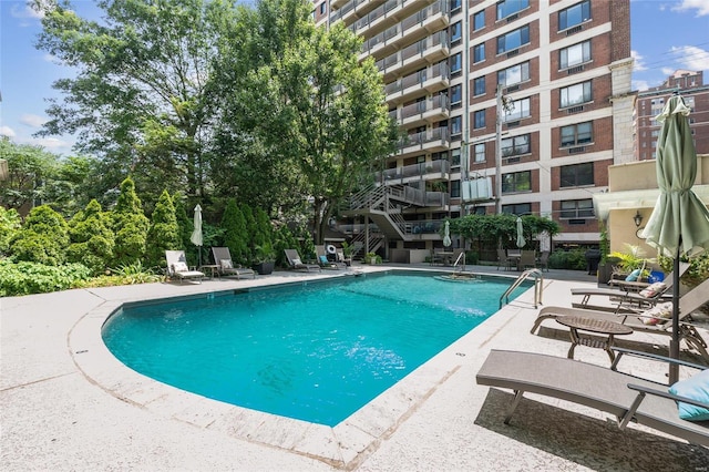 view of swimming pool with a patio area