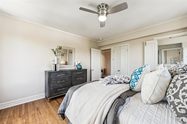 bedroom featuring ceiling fan, ornamental molding, and wood-type flooring