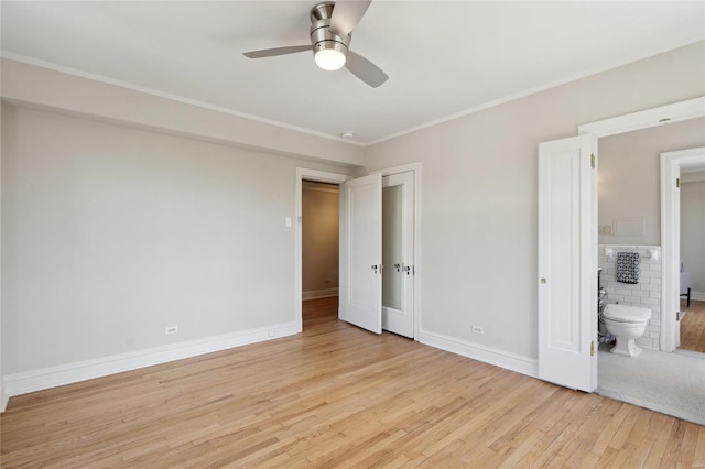 unfurnished bedroom with ceiling fan, ornamental molding, connected bathroom, and light hardwood / wood-style flooring