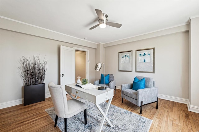 home office featuring hardwood / wood-style flooring, crown molding, and ceiling fan