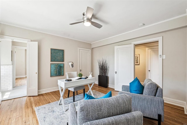 office area with ornamental molding, hardwood / wood-style floors, and ceiling fan