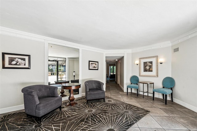 tiled living room with ornamental molding and plenty of natural light