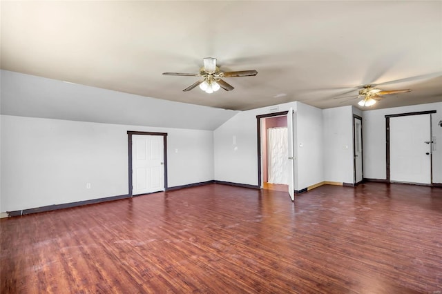 bonus room featuring dark hardwood / wood-style flooring, vaulted ceiling, and ceiling fan