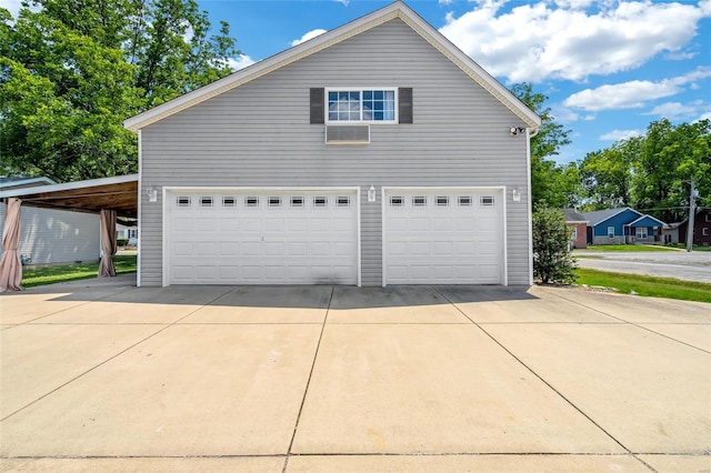 garage featuring a carport