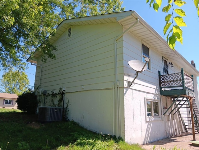 view of home's exterior with central AC unit