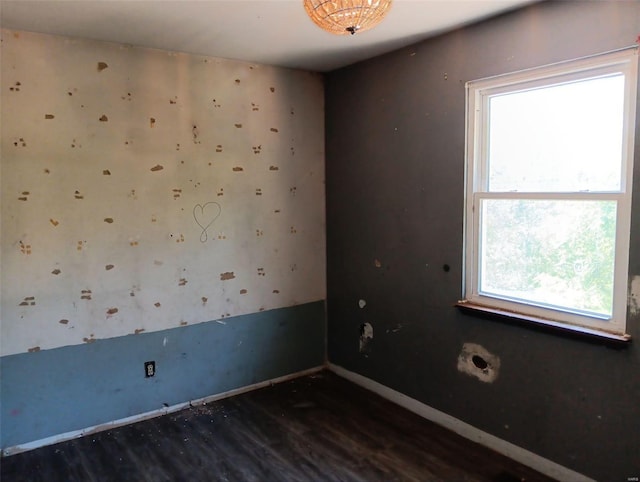 empty room featuring dark wood-type flooring